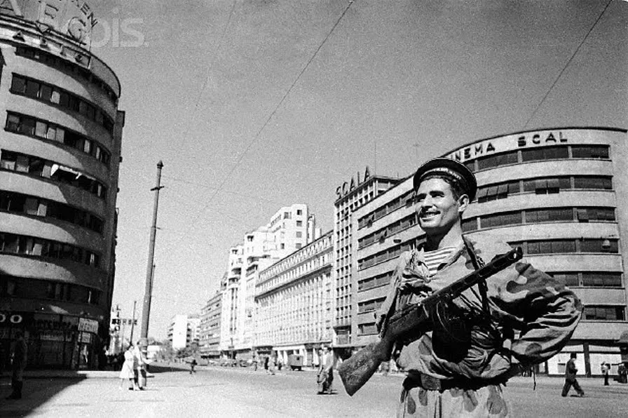 A Soviet soldier on Bulevardul Magheru in 1944, with the Jawol Building on the left and Cinema Scala on the right